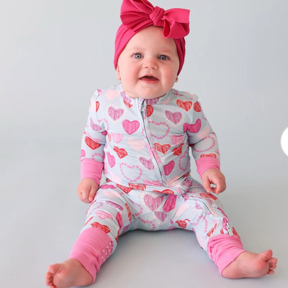 Posh peanut convertible 1 piece. Never worn. Tags still on 9-12 months
